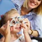 "Child rubbing eyes due to discomfort, indicating possible hidden eye problems in kids."